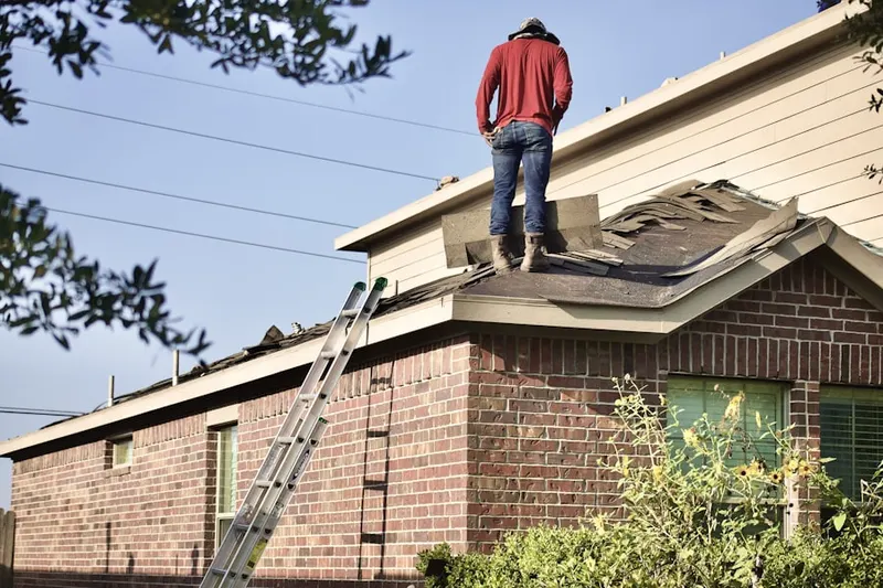 Professional roofer working on a residential roof in Virginia Beach